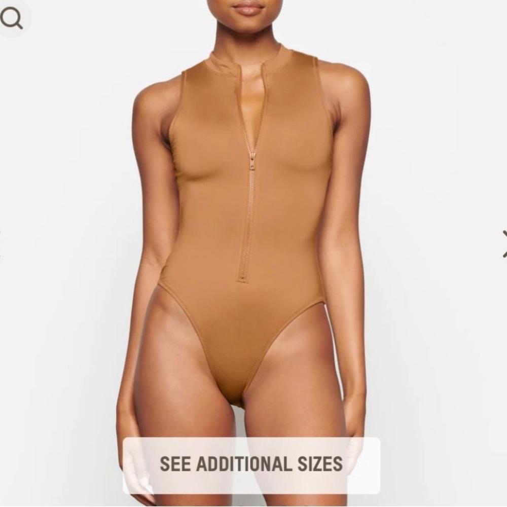 Skims zip up one piece almond xxs